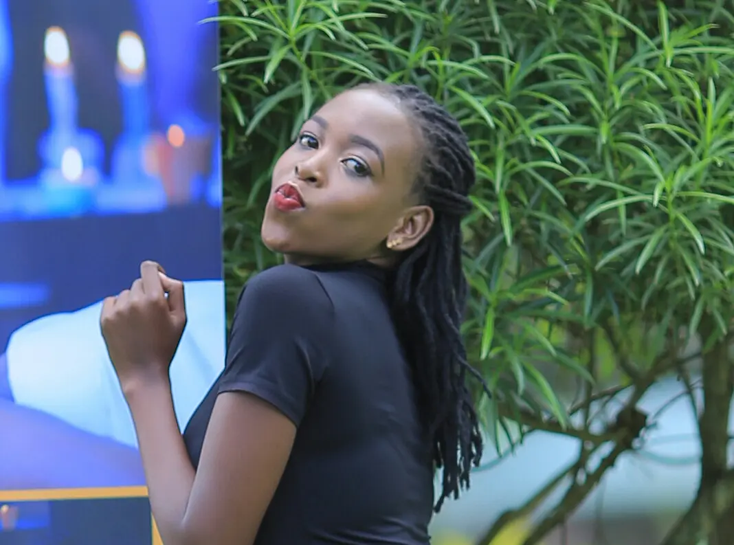 Joyce Atuheire, CEO Hands of Brama, Posing for a photo