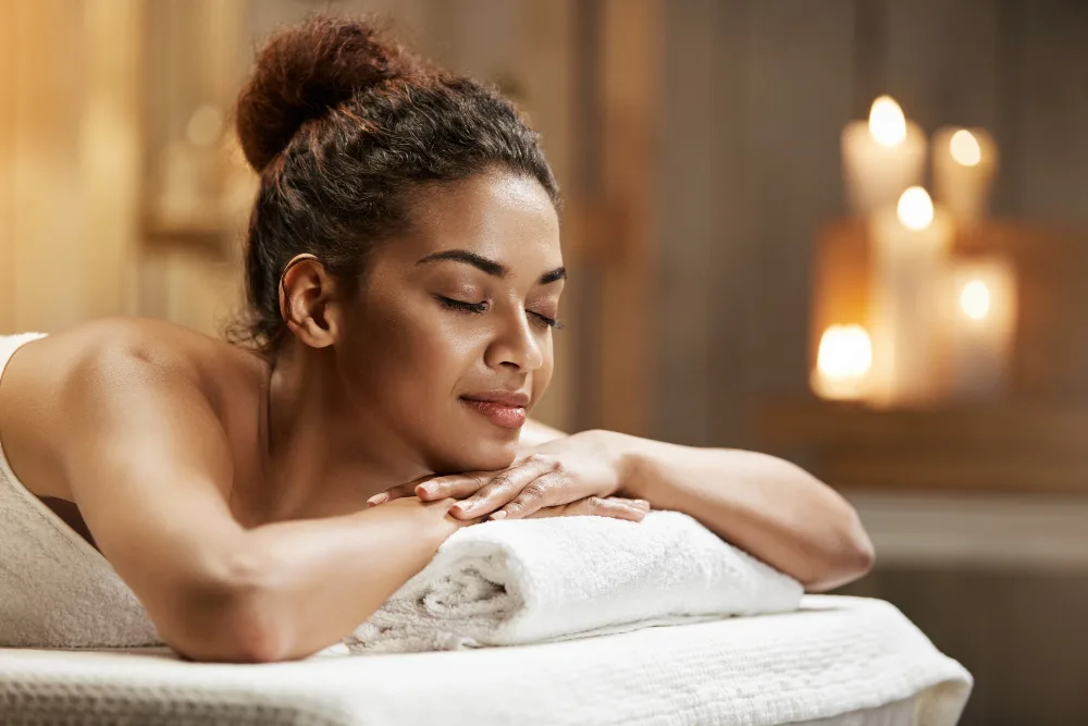 A client relaxing in the dimly lit spa ambience