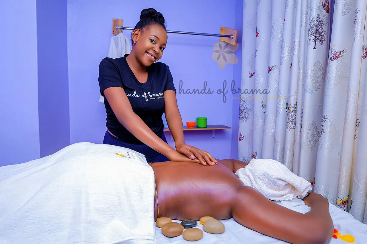 A client receiving a massage at Hands of Brama